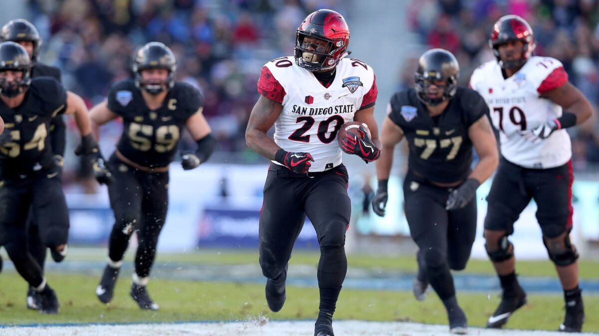 San Diego State running back Rashaad Penny rushes for one of his four touchdowns against Army in the Armed Forces Bowl.