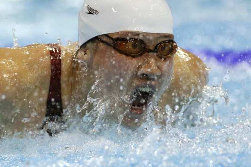 China's Jiao Liuyang churns to the gold medal in the women's 200-meter butterfly.