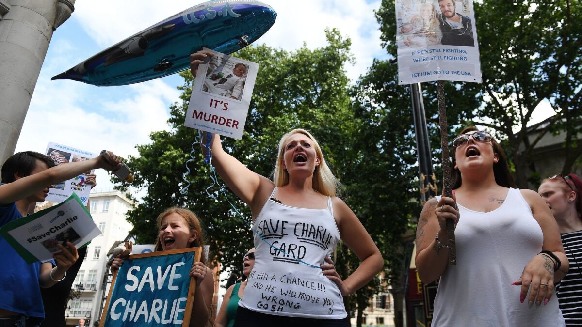 Supporters of the parents of Charlie Gard demonstrate outside the High Court in London, Britain on July 10.