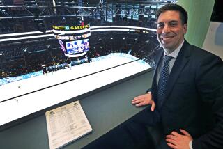 Calgary Flames assistant general manager Chris Snow poses for a portrait in a press box above the ice