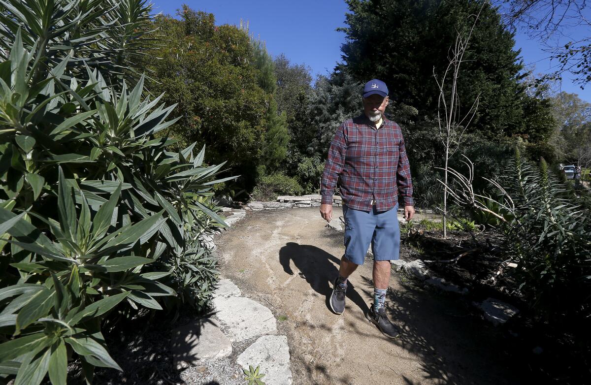 Project Manager Steve Engel walks through the Secret Garden.