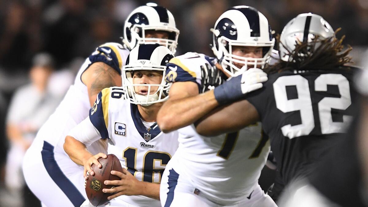 Rams quarterback Jared Goff scrambles against the Raiders.