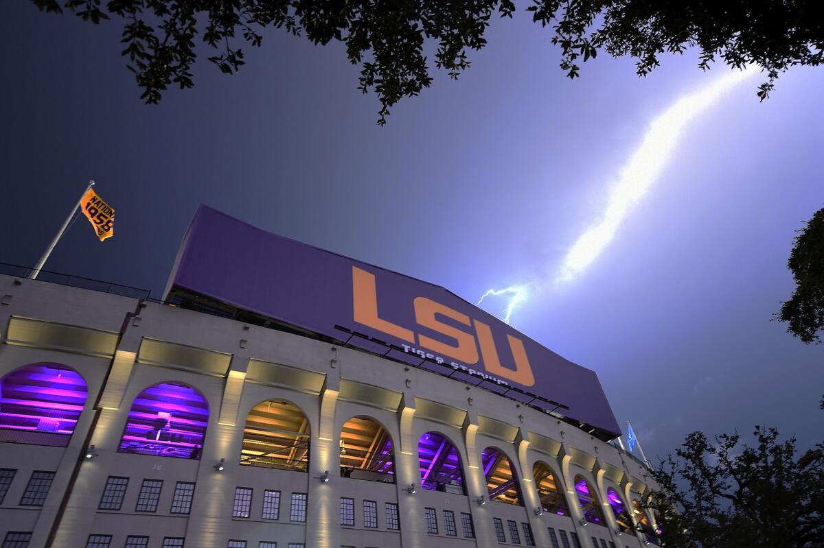 Lightning strikes outside of Tiger Stadium during a weather delay between the LSU Tigers and McNeese State Cowboys on Sept. 5, 2015.