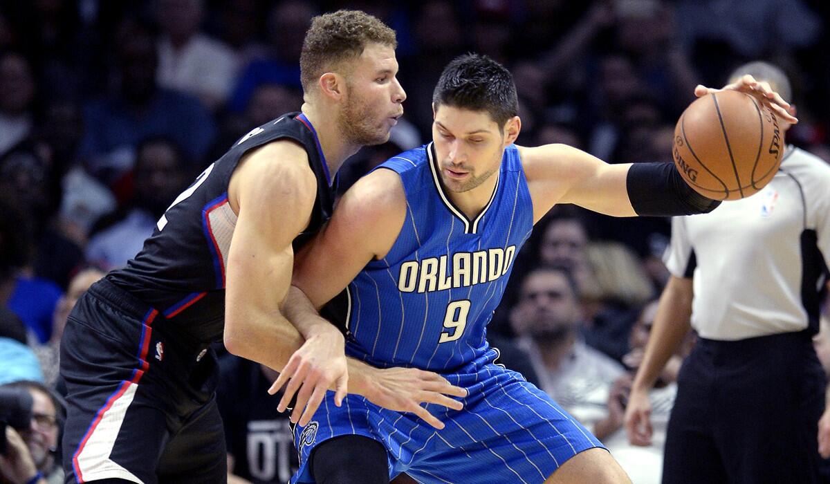 Orlando Magic center Nikola Vucevic, right, in action against Los Angeles Clippers forward Blake Griffin in the first half of the game at the Staples Center on Saturday.