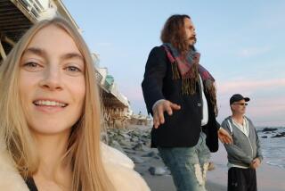 Mark Sawusch, right, on the beach in Malibu with Anna Moore and Anthony Flores.