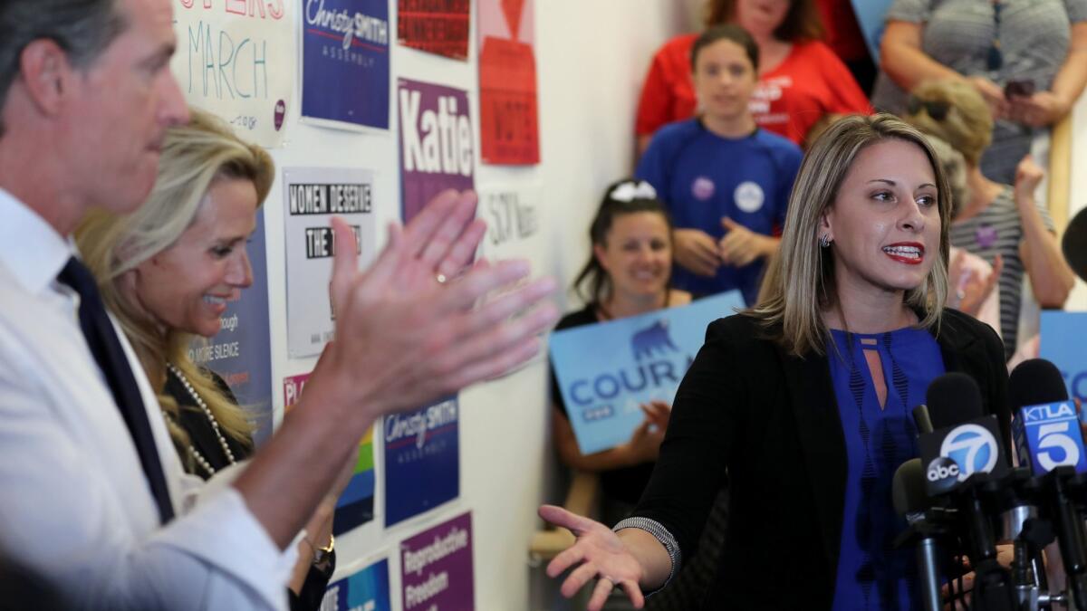 Democratic congressional candidate Katie Hill, right, speaks at a campaign rally Monday in Santa Clarita. She opposes the Republican tax cuts, which were supported by her opponent, incumbent Rep. Steve Knight (R-Palmdale).