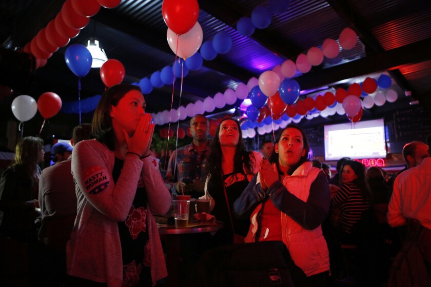 Supporters of Hillary Clinton react to a state being called for Donald Trump as they watch U.S. election returns at a viewing party organized by Democrats Abroad at a Mexico City bar.
