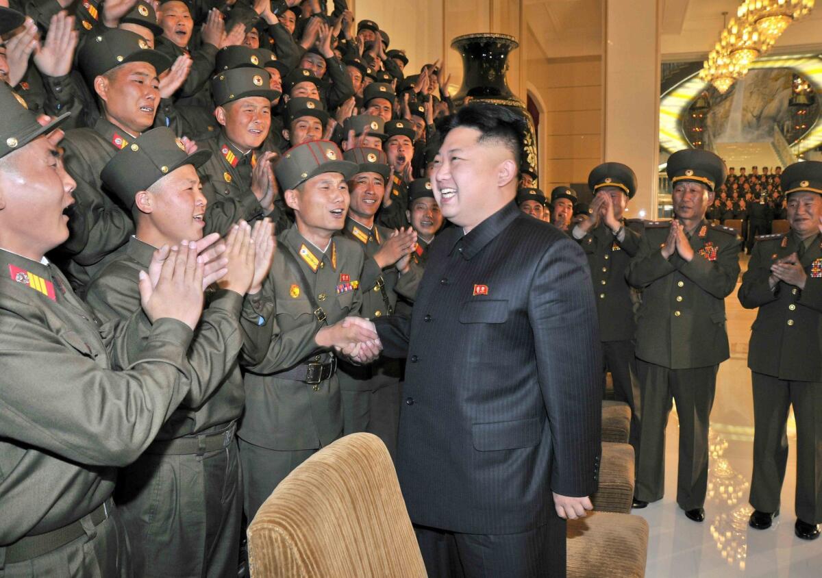 A picture released by the North Korean Central News Agency in October 2013 shows North Korean leader Kim Jong Un as he is welcomed by a group of soldiers picked to participate in a military art festival in Pyongyang.