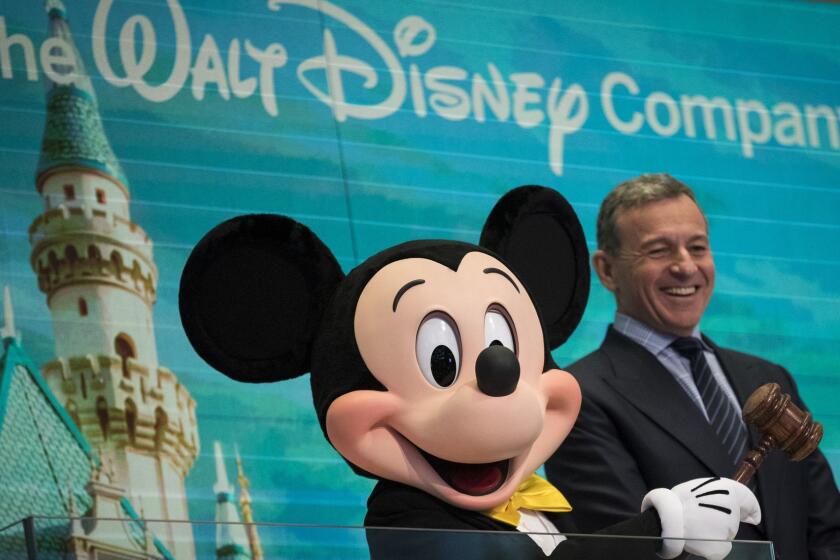 NEW YORK, NY - NOVEMBER 27: (L to R) Mickey Mouse and chief executive officer and chairman of The Walt Disney Company Bob Iger prepare to ring the opening bell at the New York Stock Exchange (NYSE), November 27, 2017 in New York City. Disney is marking the company's 60th anniversary as a listed company on the NYSE. (Drew Angerer/Getty Images) ** OUTS - ELSENT, FPG, CM - OUTS * NM, PH, VA if sourced by CT, LA or MoD **
