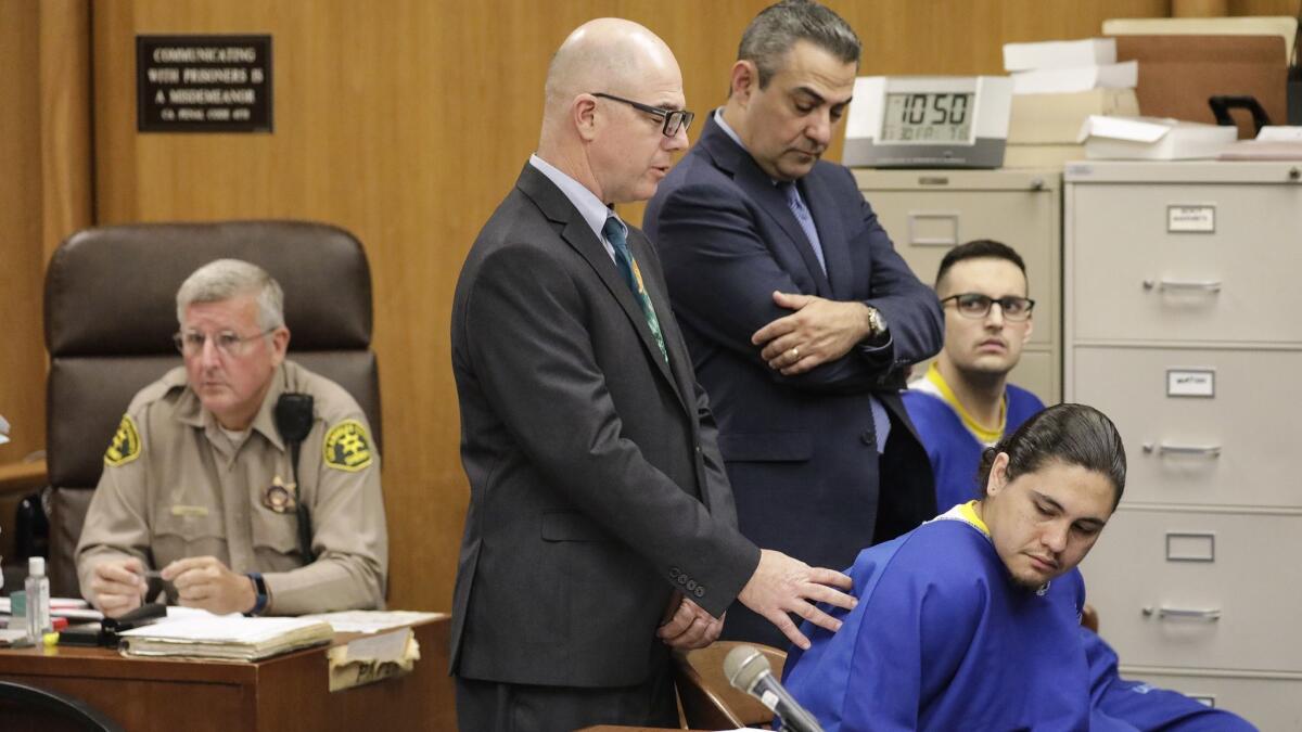 Jacob Zamora, front right, and Corey Kiefer, behind him, flanked by their attorneys, Frederick Fascenelli, left, and George Besnilian, appear in Norwalk court.