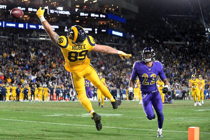 LOS ANGELES, CALIFORNIA NOVEMBER 25, 2019-Rams tight end Tyler Higbee can't make the catch in the end zone in front of Ravens cornerback Jimmy Smith in the 2nd quarter at the Coliseum Sunday. (Wally Skalij/Los Angerles Times)