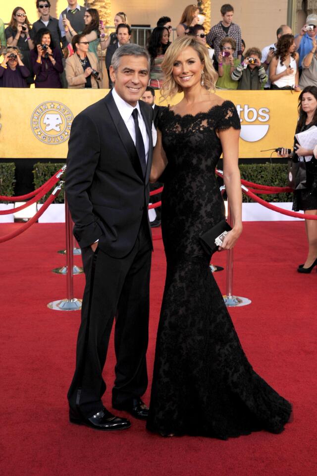 George Clooney, nominated for male in a leading role and cast in a motion picture for "The Descendants," and girlfriend Stacy Keibler.