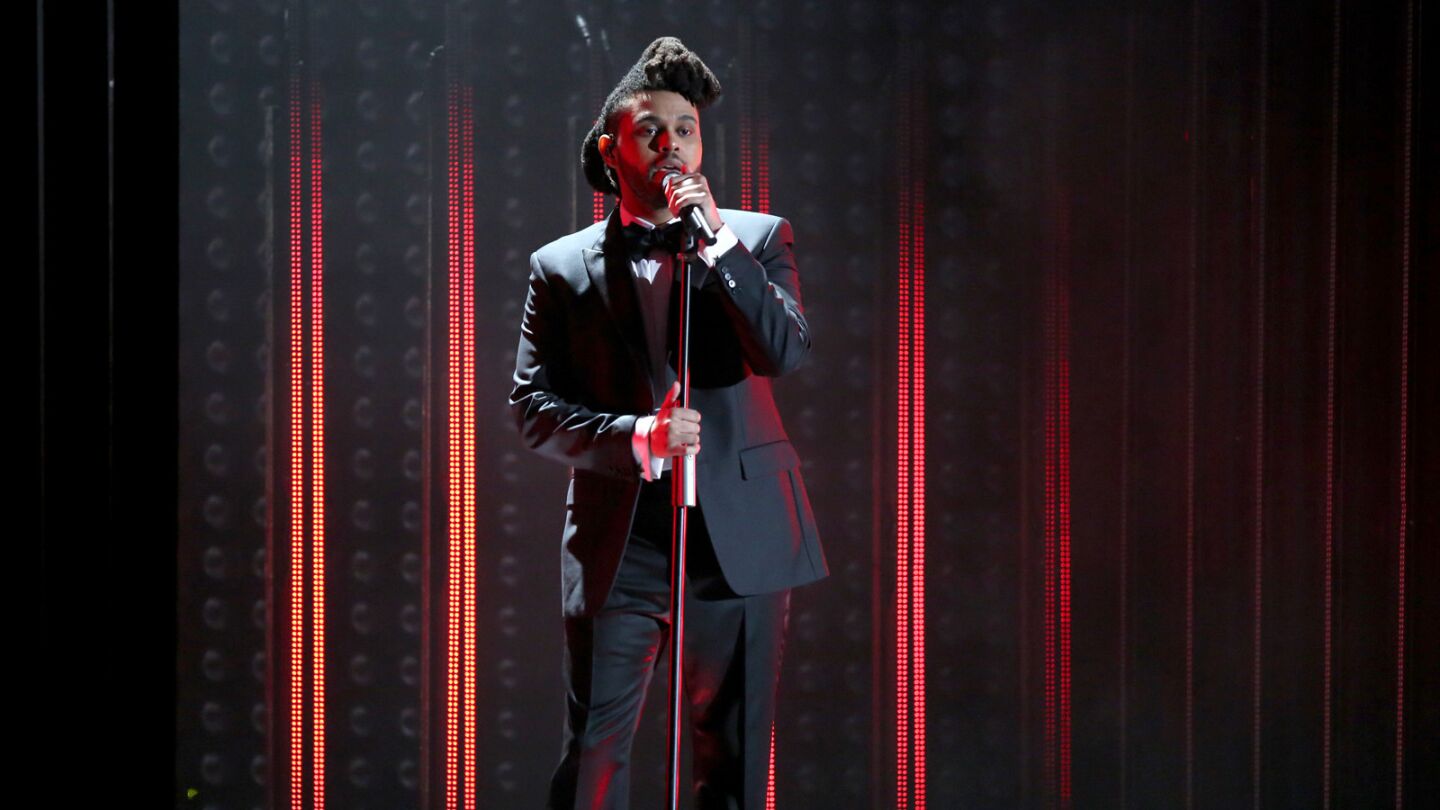 The Weeknd performs two hit songs, including "Can't Feel My Face" and "In the Night."