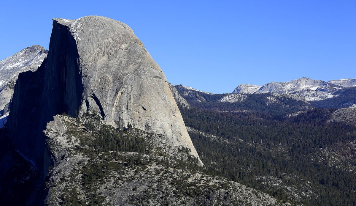 Little snow can be seen on Half Dome in a view from Glacier Point in January.