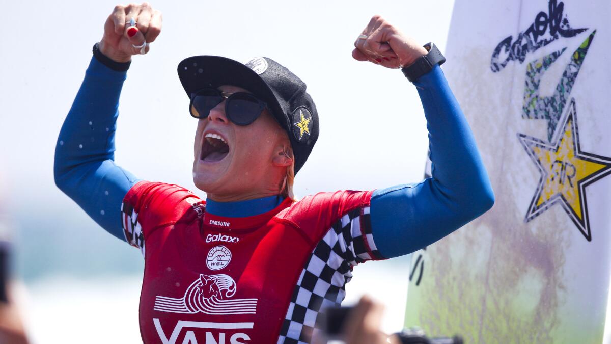 Tatiana Weston-Webb lets out a victory yell after winning the women's title at the U.S. Open of Surfing on Sunday in Huntington Beach.