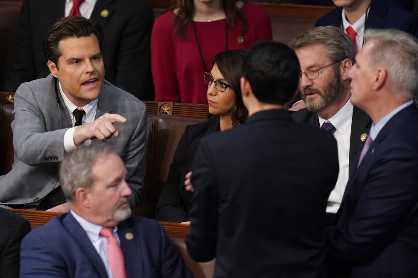 FILE - Rep. Matt Gaetz, R-Fla., left, talks to Rep. Kevin McCarthy, R-Calif., right, in the House chamber as the House meets for the fourth day to elect a speaker and convene the 118th Congress in Washington on Jan. 6, 2023. Some members of Congress are asking that the House floor be more fully open to cameras in the interest of transparency. (AP Photo/Alex Brandon, File)