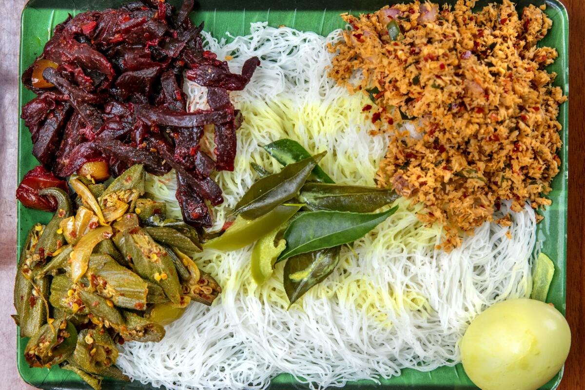 A vegetarian string hopper meal (including sides of beet curry, okra, and grated-coconut pol sambol) at Apey Kade in Tarzana.