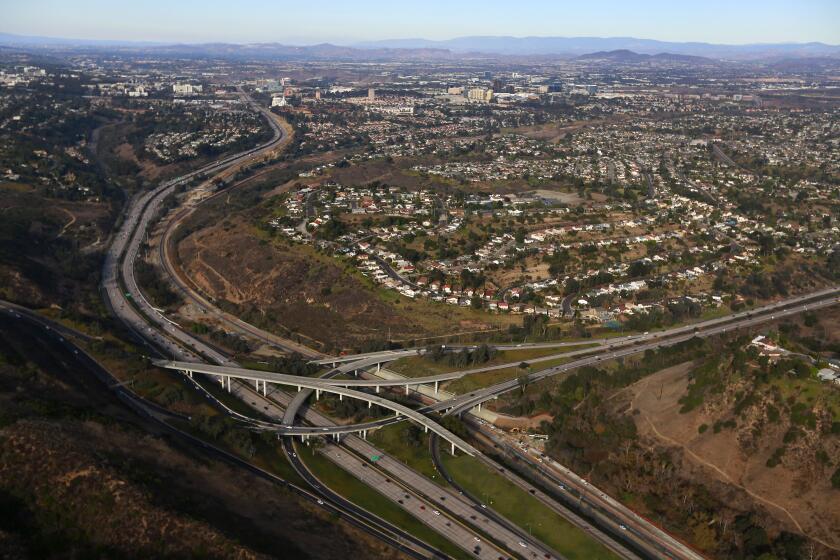 Interstate 5, left, and SR 52 surround the neighborhood of University City in San Diego on Friday, Dec. 8, 2017. (Photo by K.C. Alfred/The San Diego Union-Tribune)