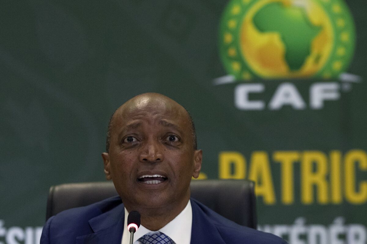 FILE - Confederation of African Football (CAF) President Patrice Motsepe speaks during a news conference in Johannesburg, South Africa, Tuesday, March 16, 2021. The African soccer confederation announced late Friday, Sept. 30, 2022 that it has removed Guinea as host of the 2025 African Cup of Nations because of inadequate infrastructure, the latest in a series of switches and delays for the continental championship over the last 10 years. It was announced after Motsepe traveled to the country to meet with the head of the military junta in Guinea who took power in a coup in 2021. (AP Photo/Themba Hadebe, File)