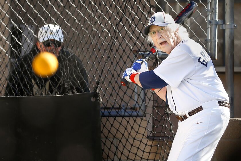 Benny Wasserman, 88, keeps his eyes on the ball at the batting cages at Home Run Park in Anaheim.