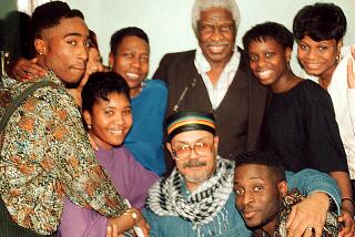 Tupac with family and friends, visiting the Shakur family patriarch, Salahdeen.
