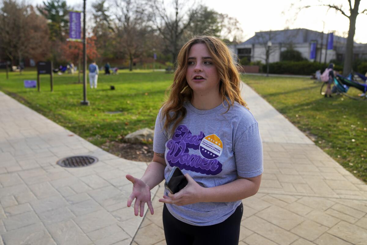 Brianna McCullough, 20, a sophomore at Chatham University in Pittsburgh, walks through campus on Thursday, Nov. 10, 2022. Support for abortion rights did drive women to the polls in Tuesday's elections. But for many, the issue took on higher meaning, part of an overarching concern about the future of democracy. "If they can take this away, they can take anything away from people. And I don't think that's right." McCullough said.(AP Photo/Gene J. Puskar)