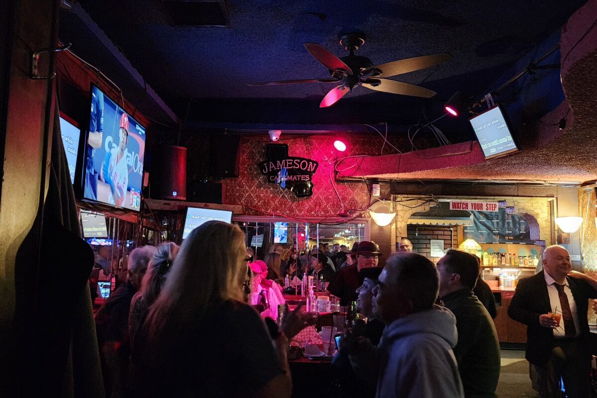 The Venice Room bar where patrons are watching the baseball game and singing karaoke