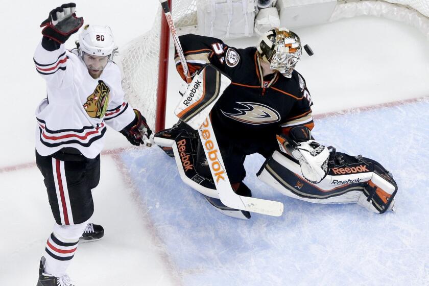 Chicago left wing Brandon Saad, celebrates teammate Jonathan Toews' goal past Ducks goalie Frederik Andersen during Game 5 of the Western Conference finals on Monday.