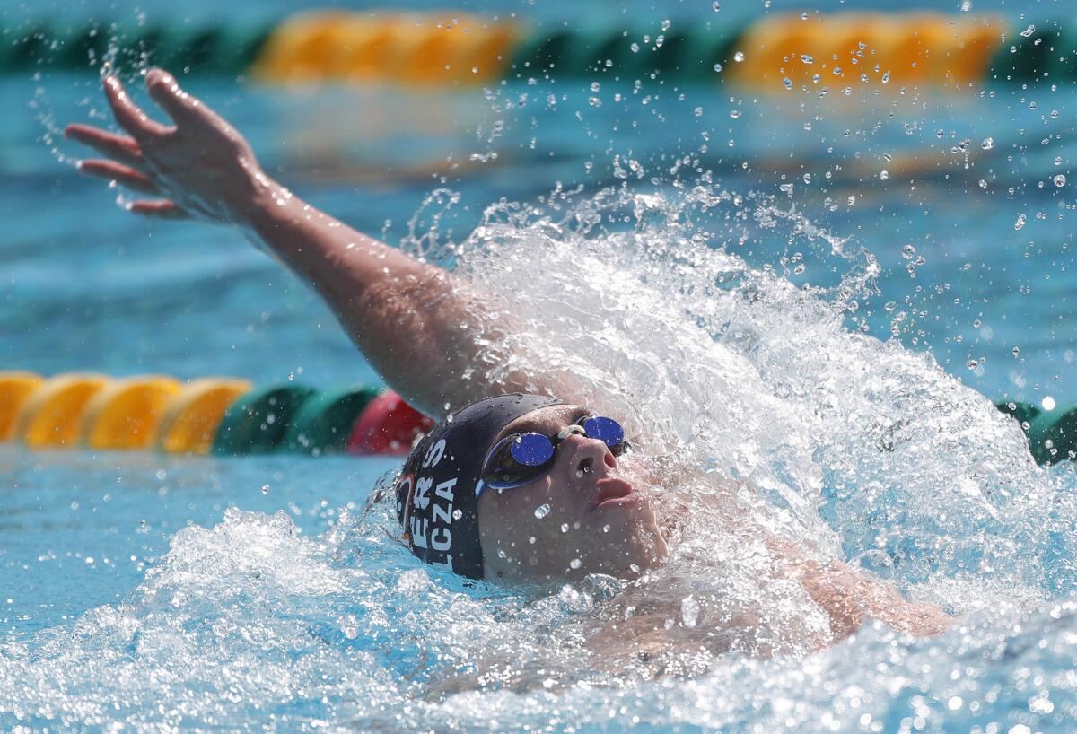Finneas Tas Palcza of Huntington Beach swims the backstroke of the boys' 200 individual medley during Wave League finals.