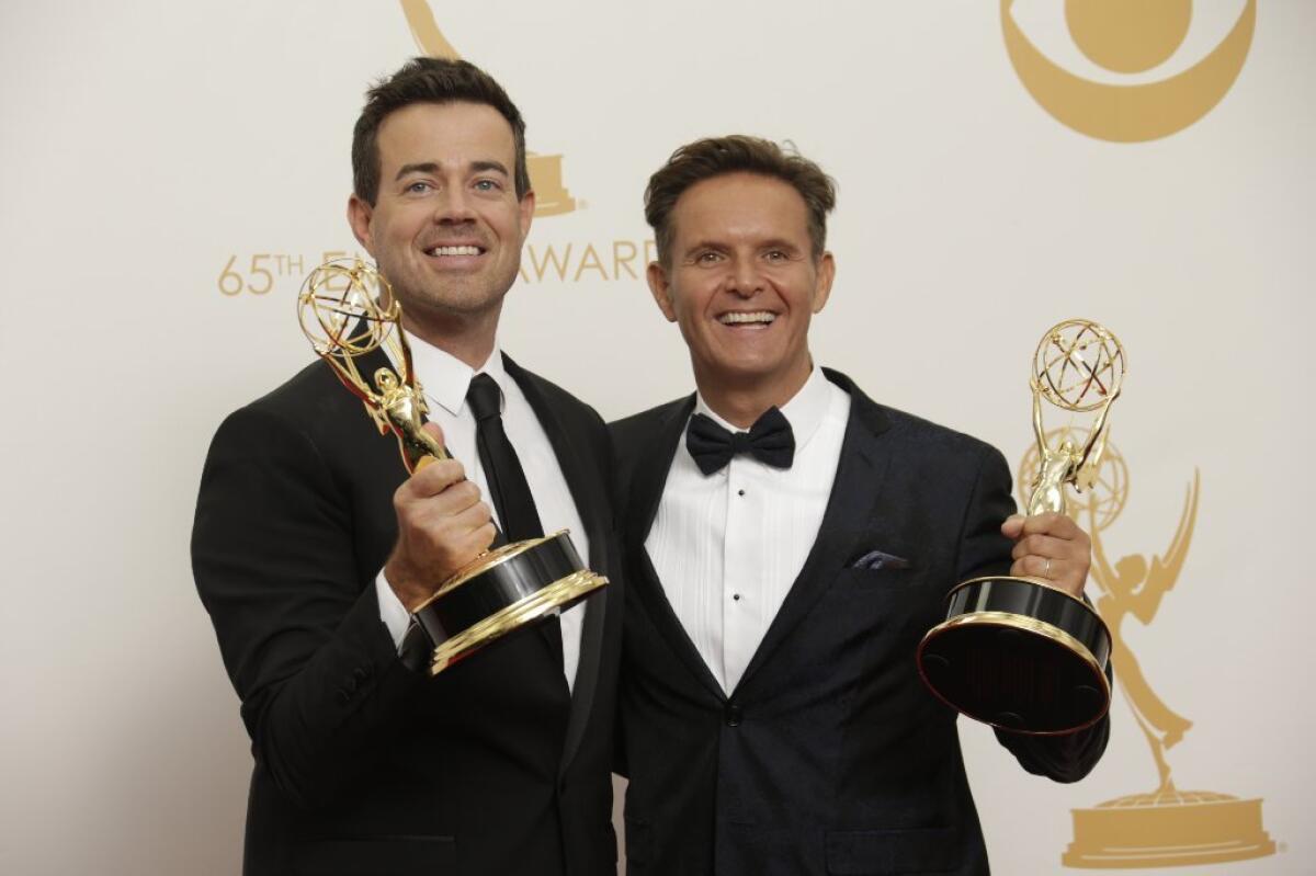 Producer Carson Daly, from left, and executive producer Mark Burnett of "The Voice" celebrate winning reality - competition program in the press room at the 65th Annual Primetime Emmy Awards.