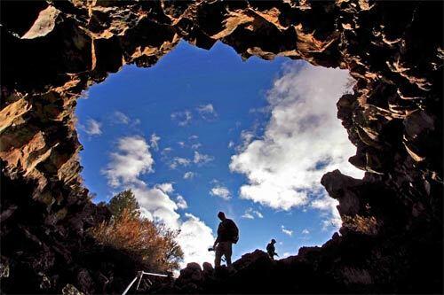 Lava Beds National Monument in Northern California has 150 miles of hiking trails. Skull Cave, shown here, was named for the animal and human skulls discovered there.