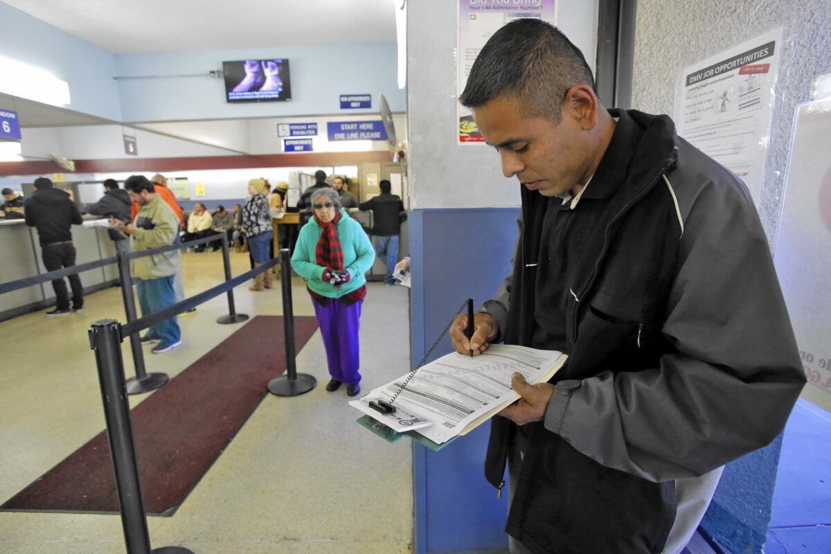 Eduardo Becerra gets his driver's permit at the DMV in Lincoln Park last year, after California began allowing immigrants in the U.S. illegally to obtain driver's licenses.