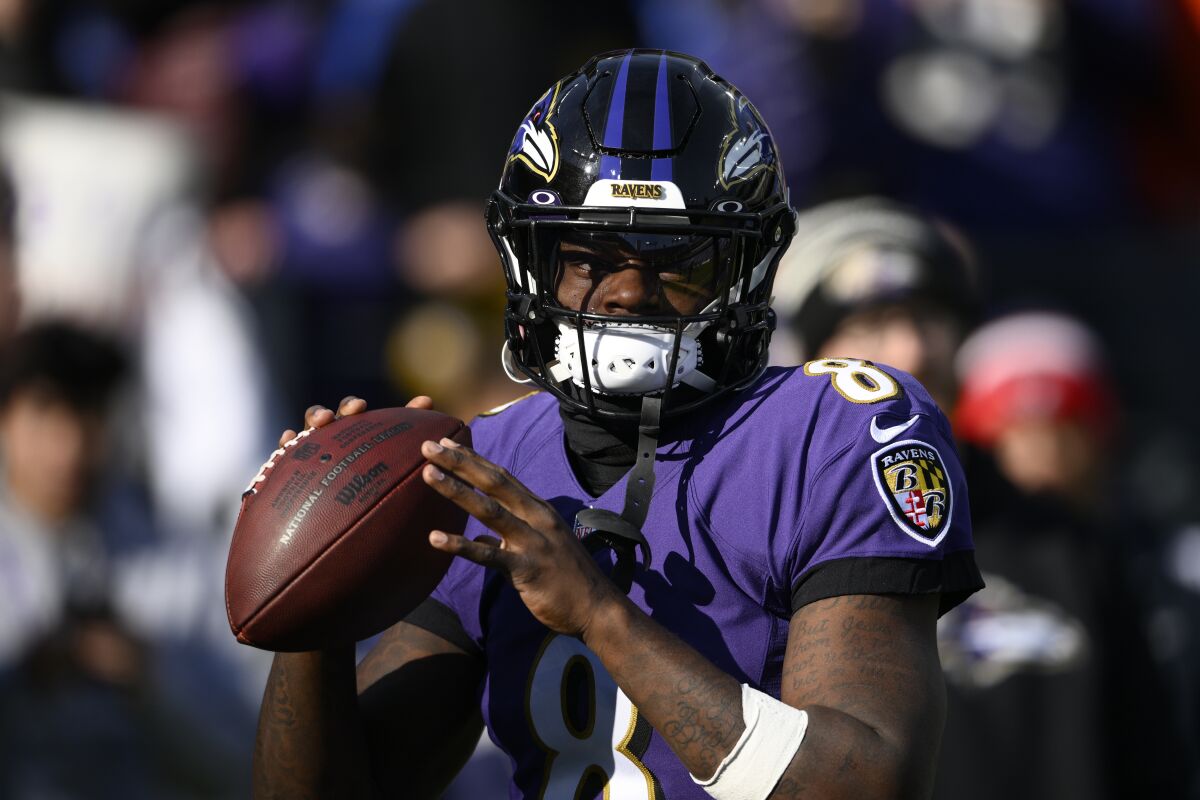 Baltimore Ravens quarterback Lamar Jackson (8) warms up before an NFL football game