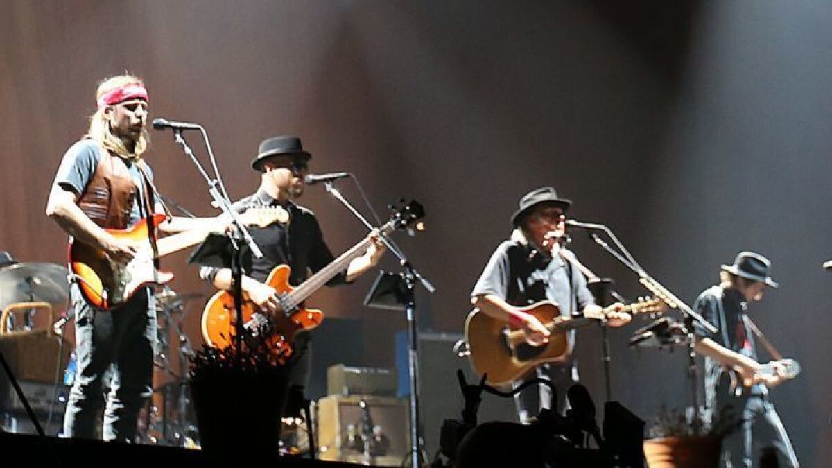 Neil Young, second from right, performs with Lukas Nelson, left, and Promise of the Real at Desert Trip in Indio in 2016