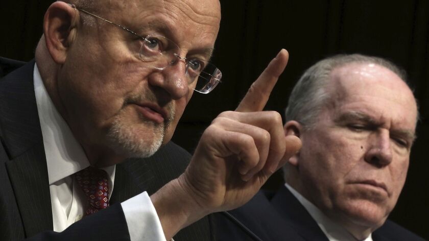 James R. Clapper, left, and John Brennan testify on Capitol Hill in 2013. Clapper previously served as director of national intelligence; Brennan was CIA director.