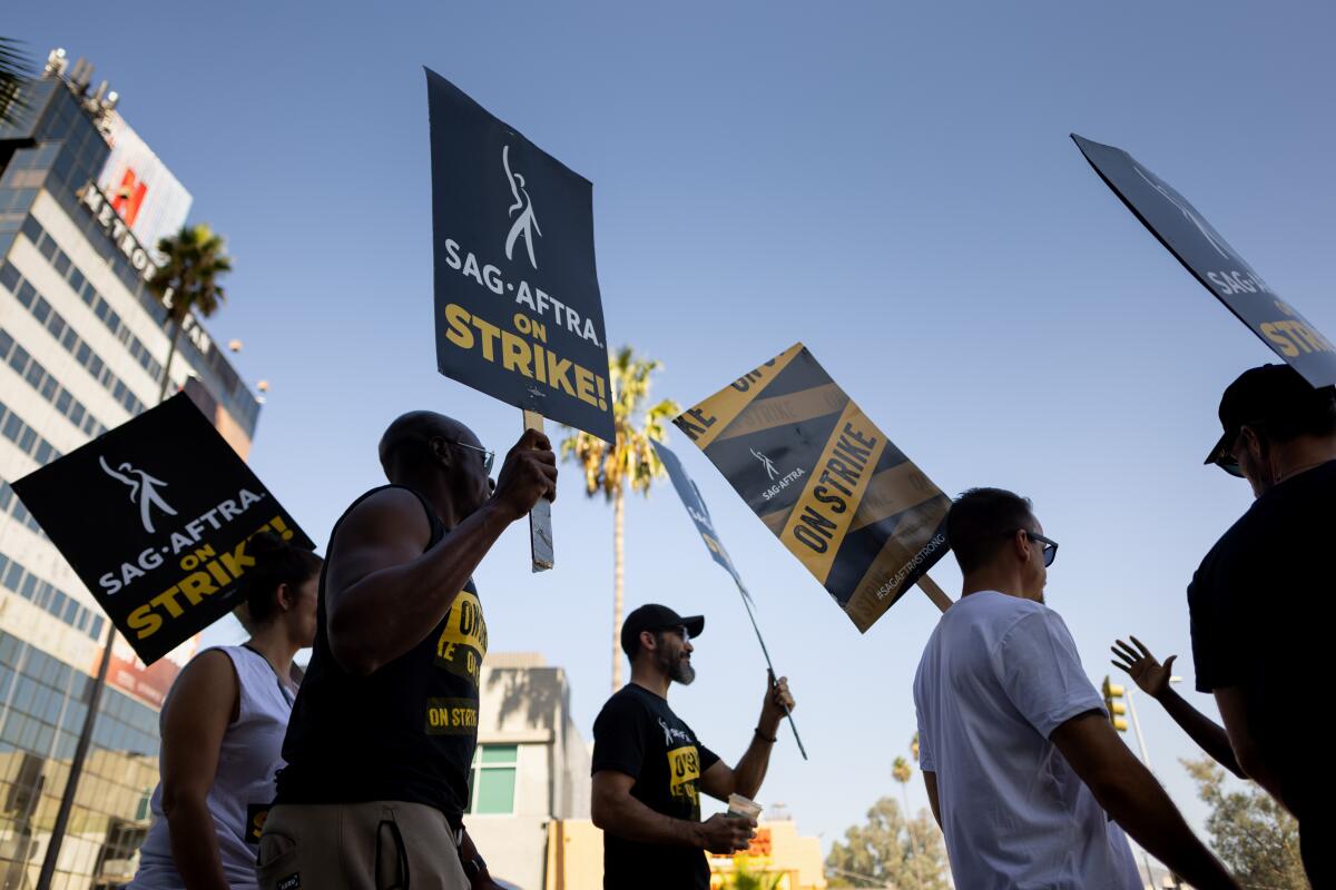 Supporters of SAG-AFTRA picket in front of the Netflix offices along Sunset Boulevard in Los Angeles.