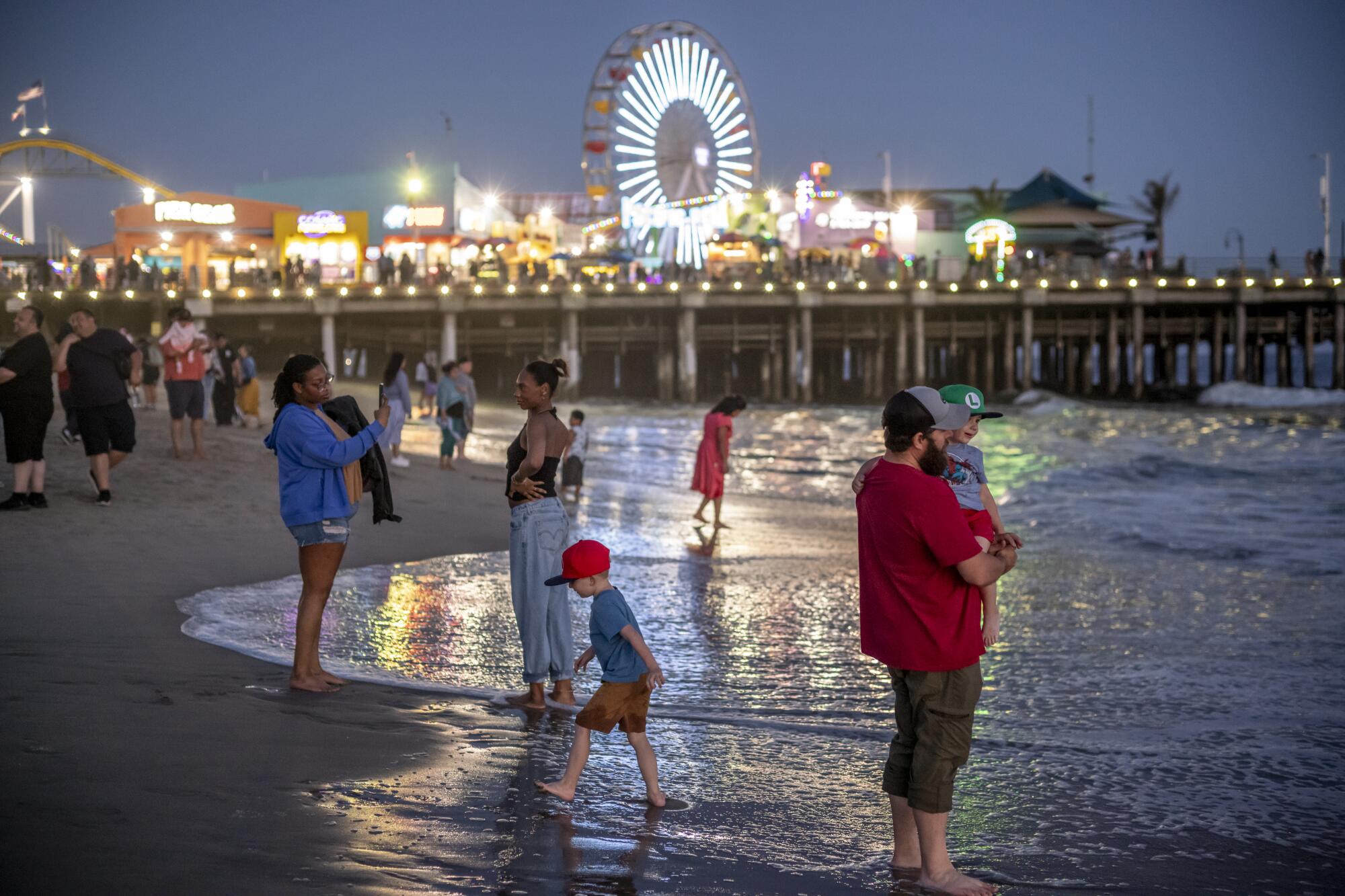 Beachgoers enjoying the scene near the Santa Monica Pier