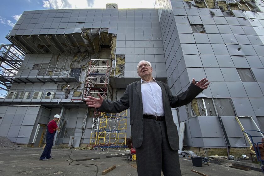 Mykola Shulga, general director of the National Scientific Center "Kharkov Institute of Physics and Technology" shows a destruction of the nuclear laboratory building after a Russian attach in Kharkiv, Ukraine, Thursday, May 18, 2023. More than a year after missiles first hit, the wind batters boarded-up windows and exposed insulation flaps in the wind. Debris has been heaped in piles, and rocket parts sit near craters up to 2.5 meters (8 feet) deep. (AP Photo/Oleksandr Brynza)