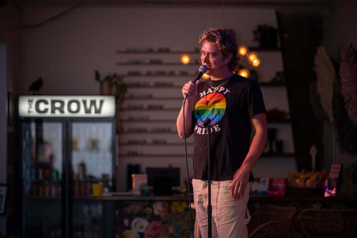 A person onstage holding a microphone.