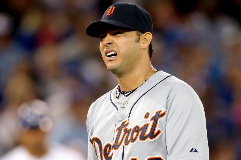 Tigers starting pitcher Anibal Sanchez grimaces as he exits a game in Toronto on Friday night because of an injury.