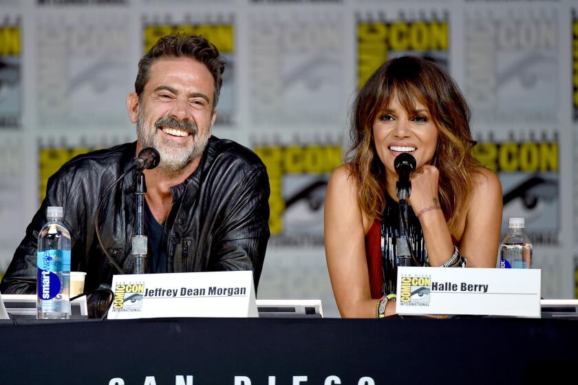 Jeffrey Dean Morgan and Halle Berry onstage for the "Extant" panel during Comic-Con International 2015 in San Diego.