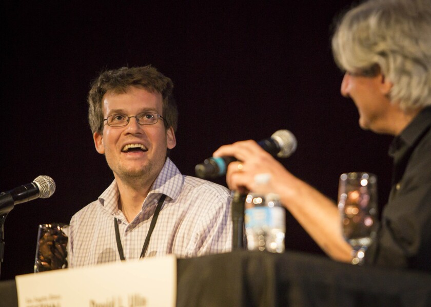 John Green, left, speaks Saturday with L.A. Times writer David Ulin at the Festival of Books.