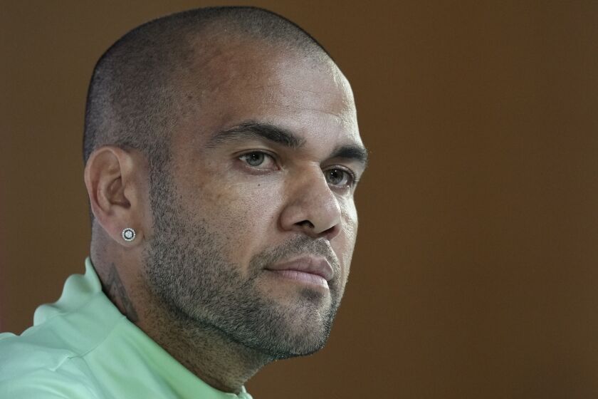 FILE - Brazil's Dani Alves listens to a question during a press conference on the eve of the group G of World Cup soccer match between Brazil and Cameroon in Doha, Qatar, on Dec. 1, 2022. The judge overseeing the investigation into the Dani Alves sexual assault case took testimony from eight witnesses at a closed hearing in Barcelona on Friday, Feb. 3, 2023. (AP Photo/Andre Penner, File)