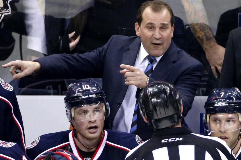 Todd Richards talks with an official during a Blue Jackets game against the Penguins on Dec. 13, 2014.