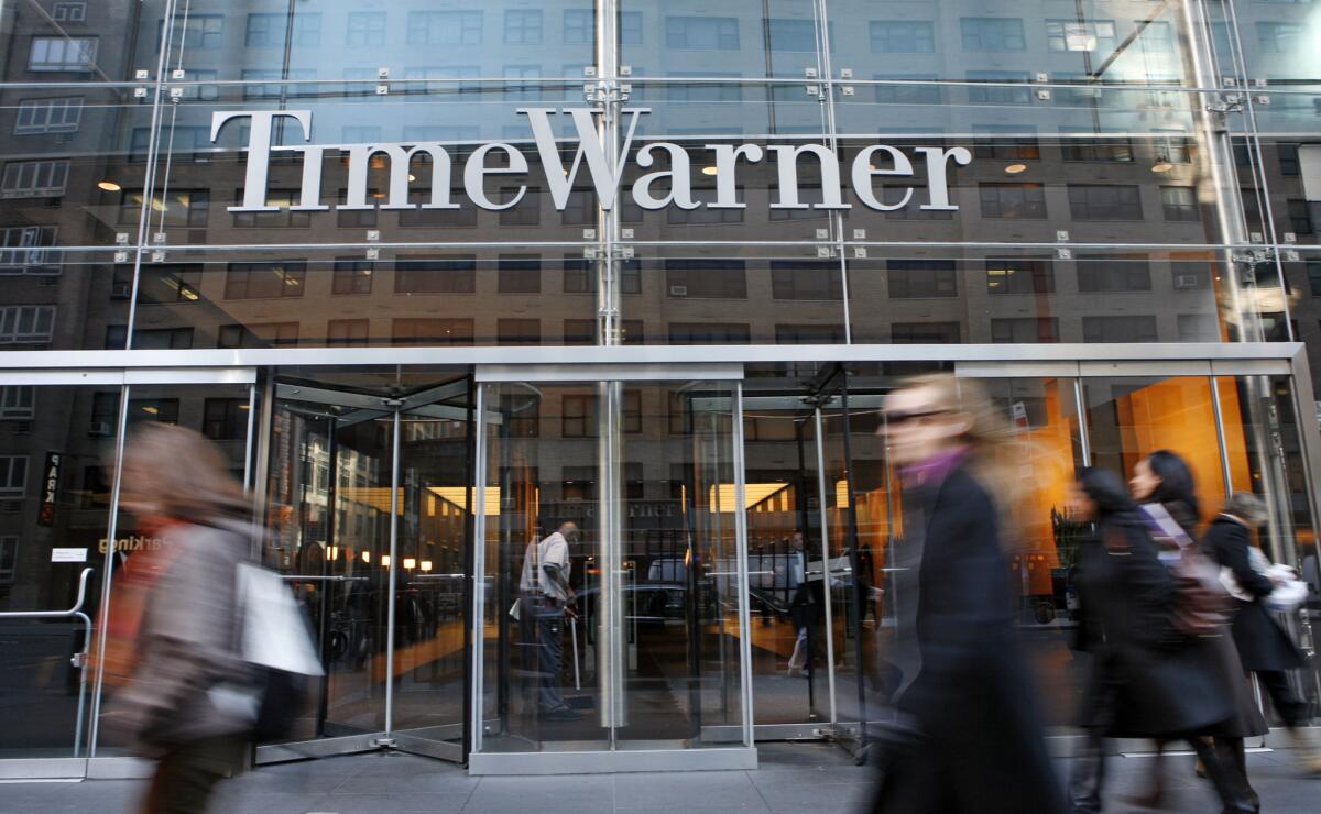 Time Warner executives on Wednesday expressed dismay over a dispute with satellite-TV giant Dish Network, which has dropped several Turner Broadcasting channels, including CNN and Cartoon Network.