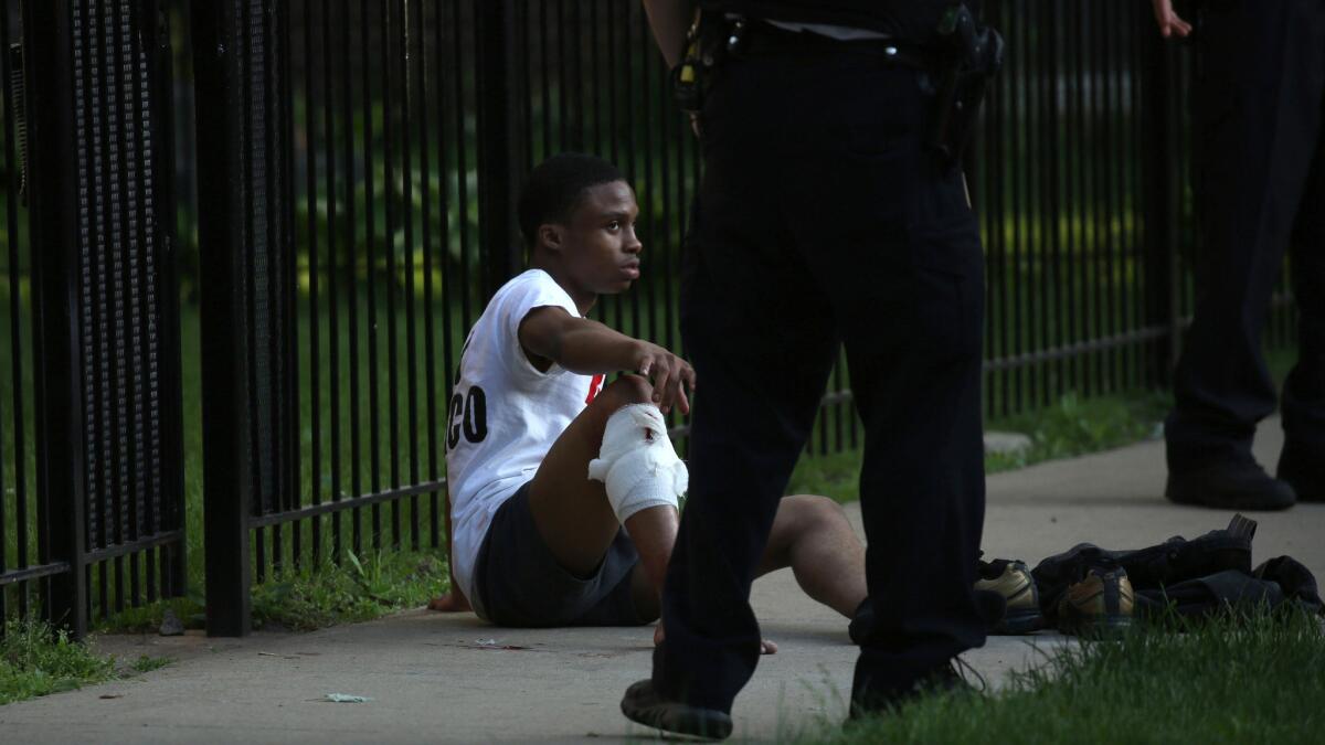 A wounded man in Chicago's West Woodlawn neighborhood was one of 69 people shot in the city during the holiday weekend.