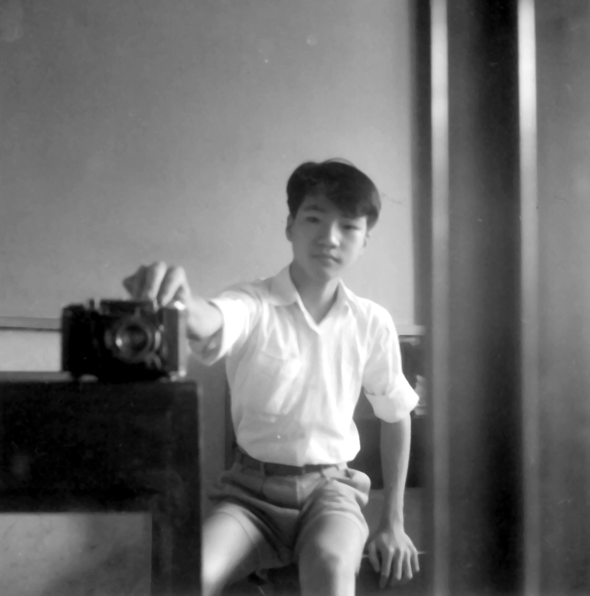 Burn Lin takes a selfie as a youth. 