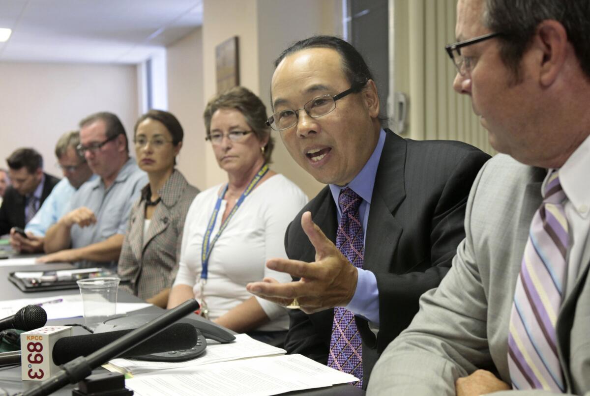 Dave Low, chairman of Californians for Retirement Security, accompanied by other representatives of various public employee unions, discusses his opposition to Gov. Jerry Brown's reform plan for California's public pension system at a news conference in Sacramento.