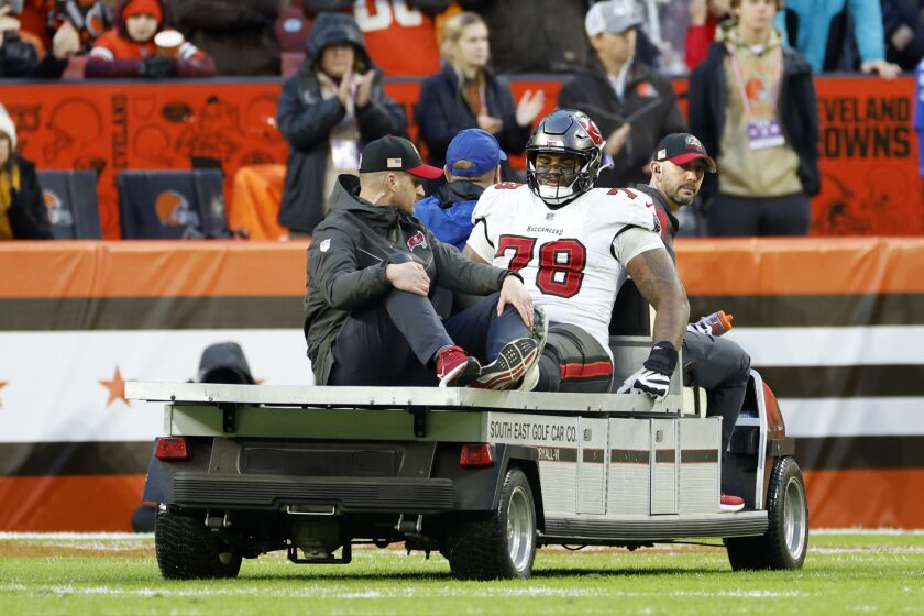 Tampa Bay Buccaneers offensive tackle Tristan Wirfs (78) is carted off the field after being injured during the second half of the team's NFL football game against the Cleveland Browns in Cleveland, Sunday, Nov. 27, 2022. Cleveland won in overtime, 23-17. (AP Photo/Ron Schwane)