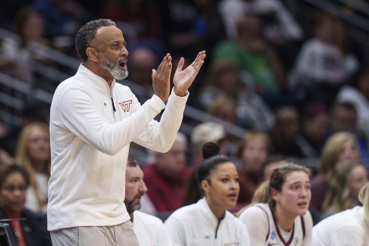 Virginia Tech head coach Kenny Brooks yells to his team during the first half of a Sweet 16 college basketball game of the NCAA Tournament against Tennessee, Saturday, March 25, 2023, in Seattle. (AP Photo/Stephen Brashear)